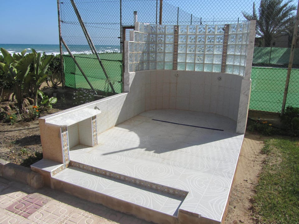 Communal showers as you come of the beach.