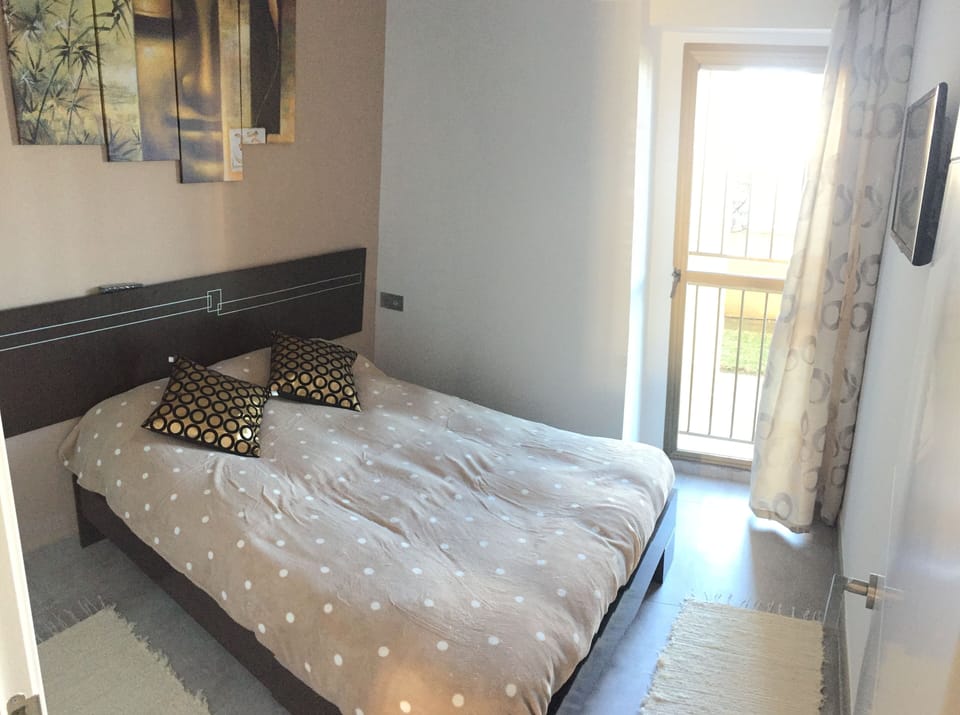 2nd bedroom with sea views, 24" TV and fitted wardrobe. 