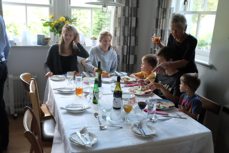 Walking in the woods with the peak of Lochnagar behind.