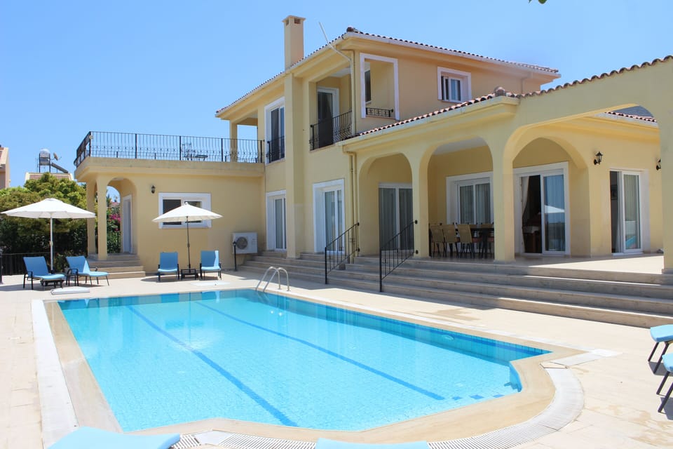 view of the villa and swimming pool