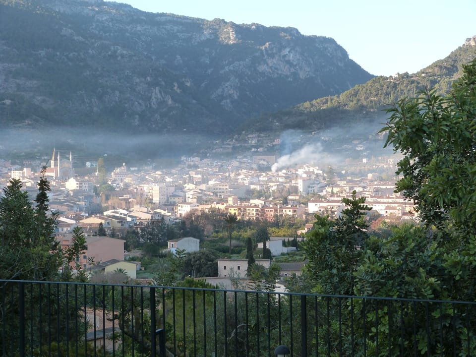 View from the villa of Soller and the cathedral in the morning mist