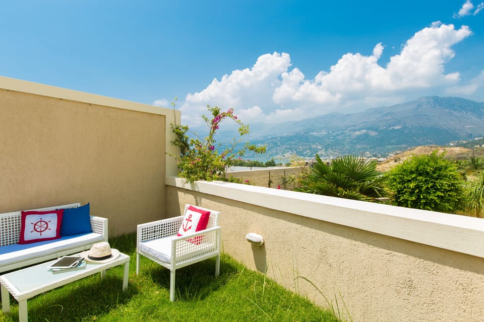 Lawn covered terrace with outdoor sitting area and views of the area!