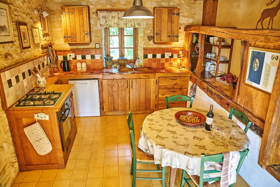 The handmade kitchen and dining area made from the original cattle byre