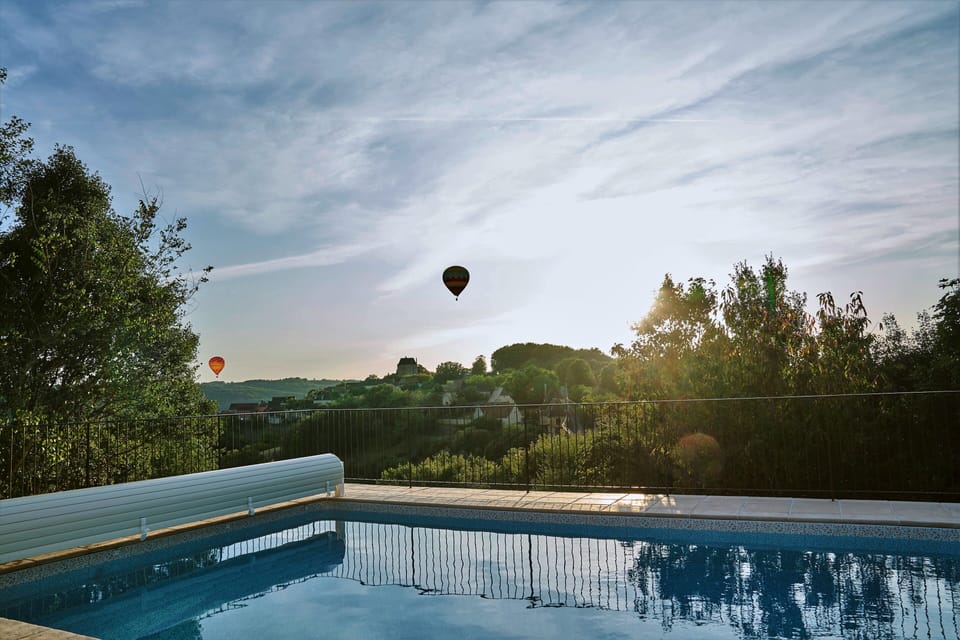 The view of Chateau Peyruzel from the swimming pool