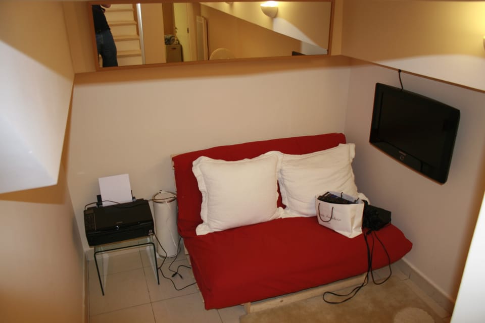 Futon at cave level with TV for games