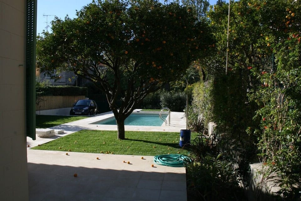 Pool view from side of house