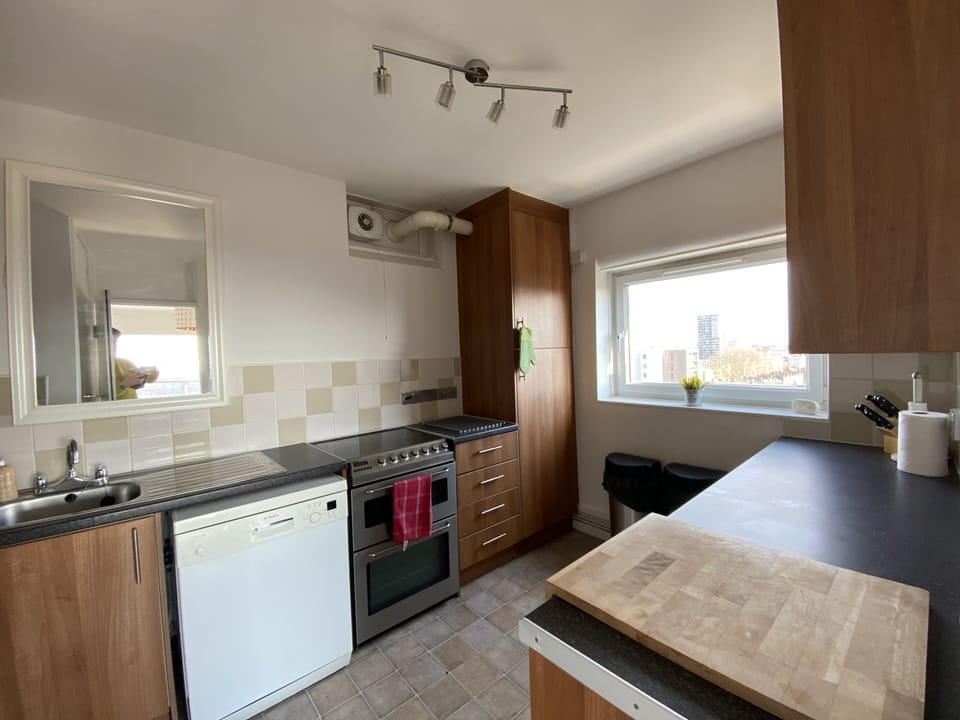 Kitchen with Washer machine/dryer, Dishwasher, Double oven and Microwave.  