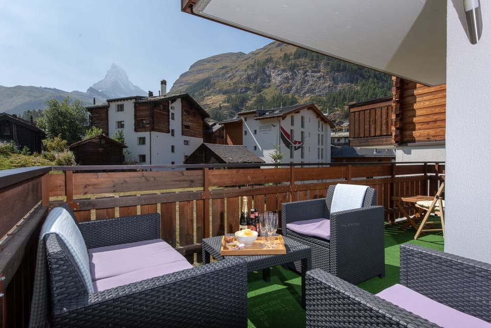 Large balcony with sofa and 2 armchairs
