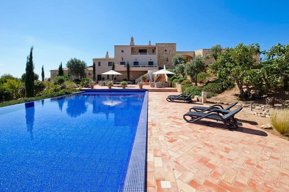 Daytime pool and house view
