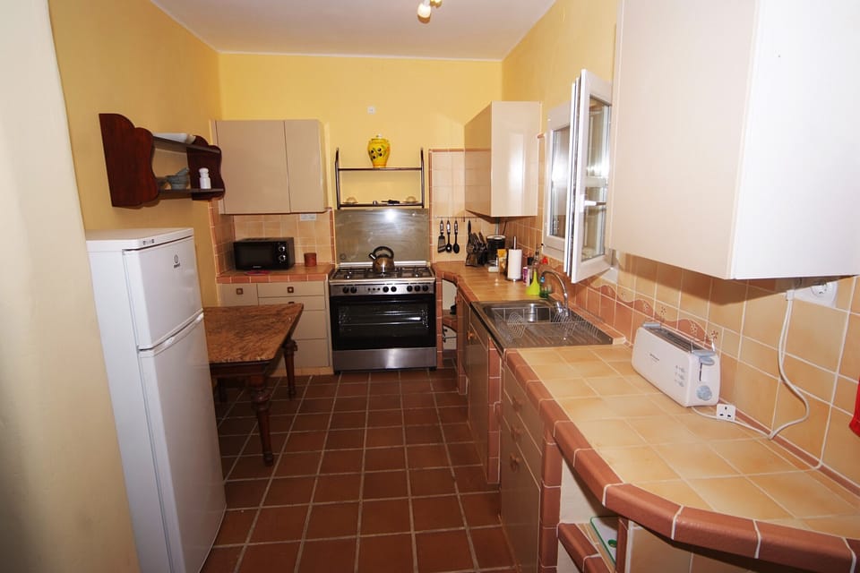 Well appointed kitchen with gas fired range