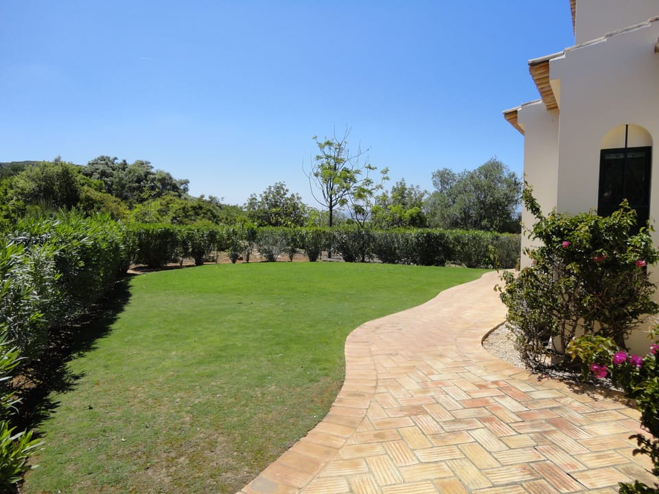 Lawn to the side of the villa for ball games and outdoor Table Tennis.