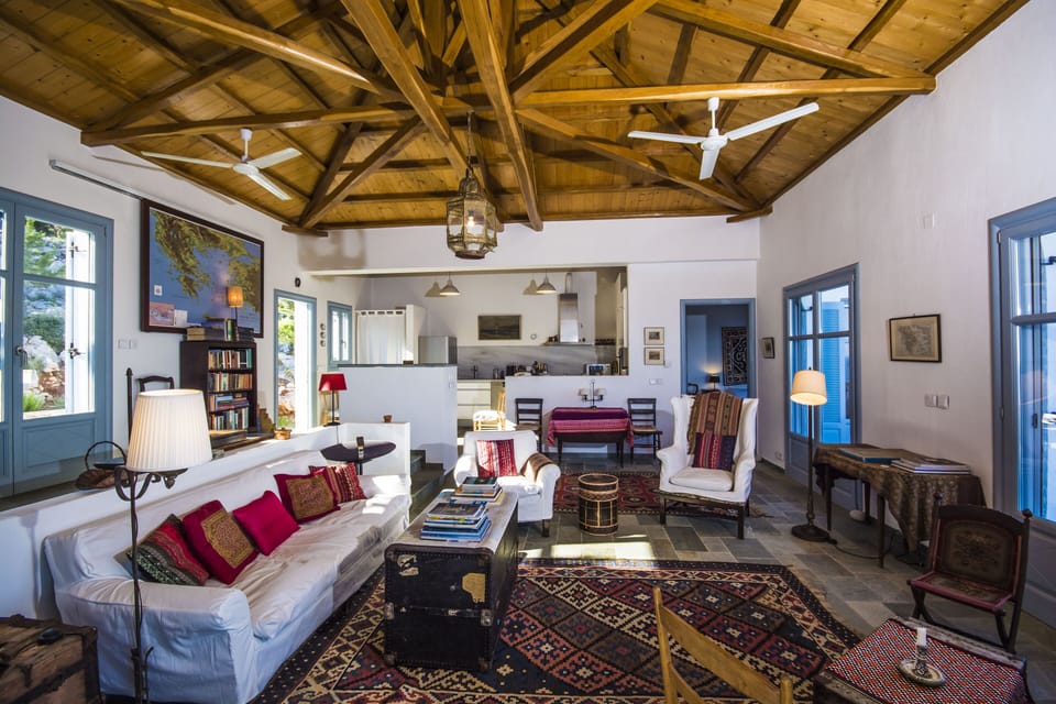 Living room towards kitchen from the South veranda; entrance to the main bedroom