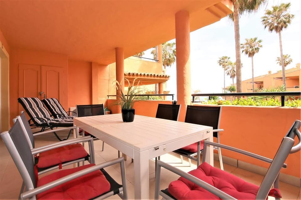 Terrace with dining table for six and two sunloungers