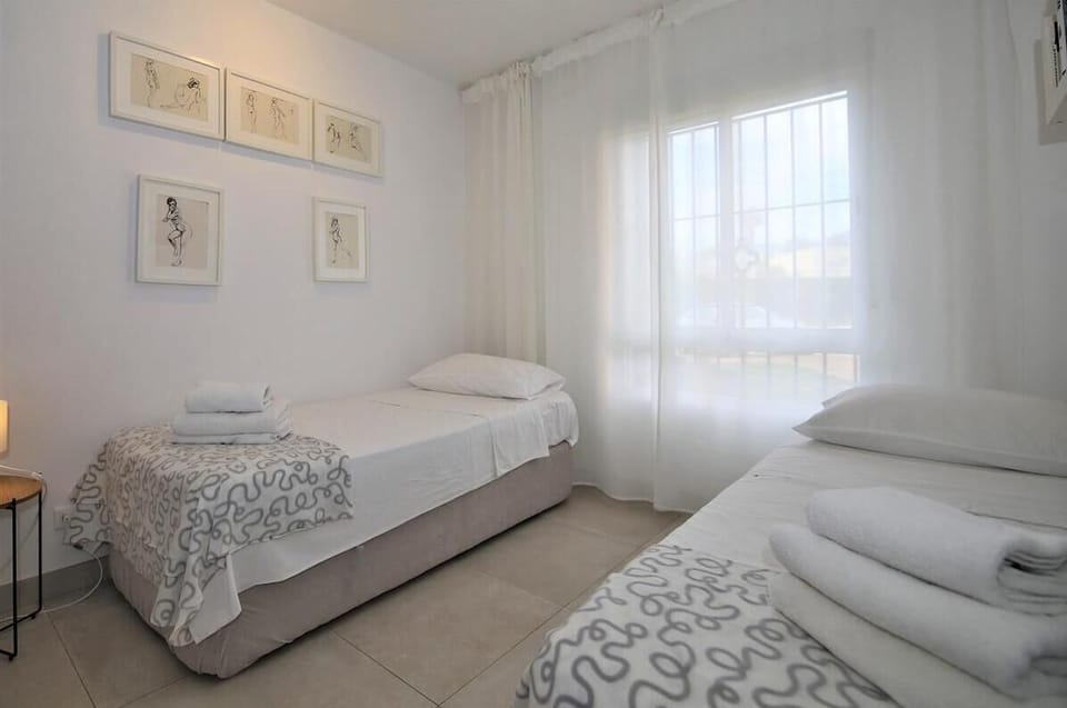 Twin bedroom is also equipped with spacious built-in wardrobe