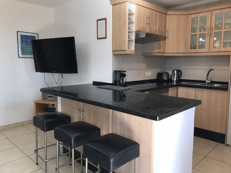 Additional seating for dining in. Large cupboard for storage.