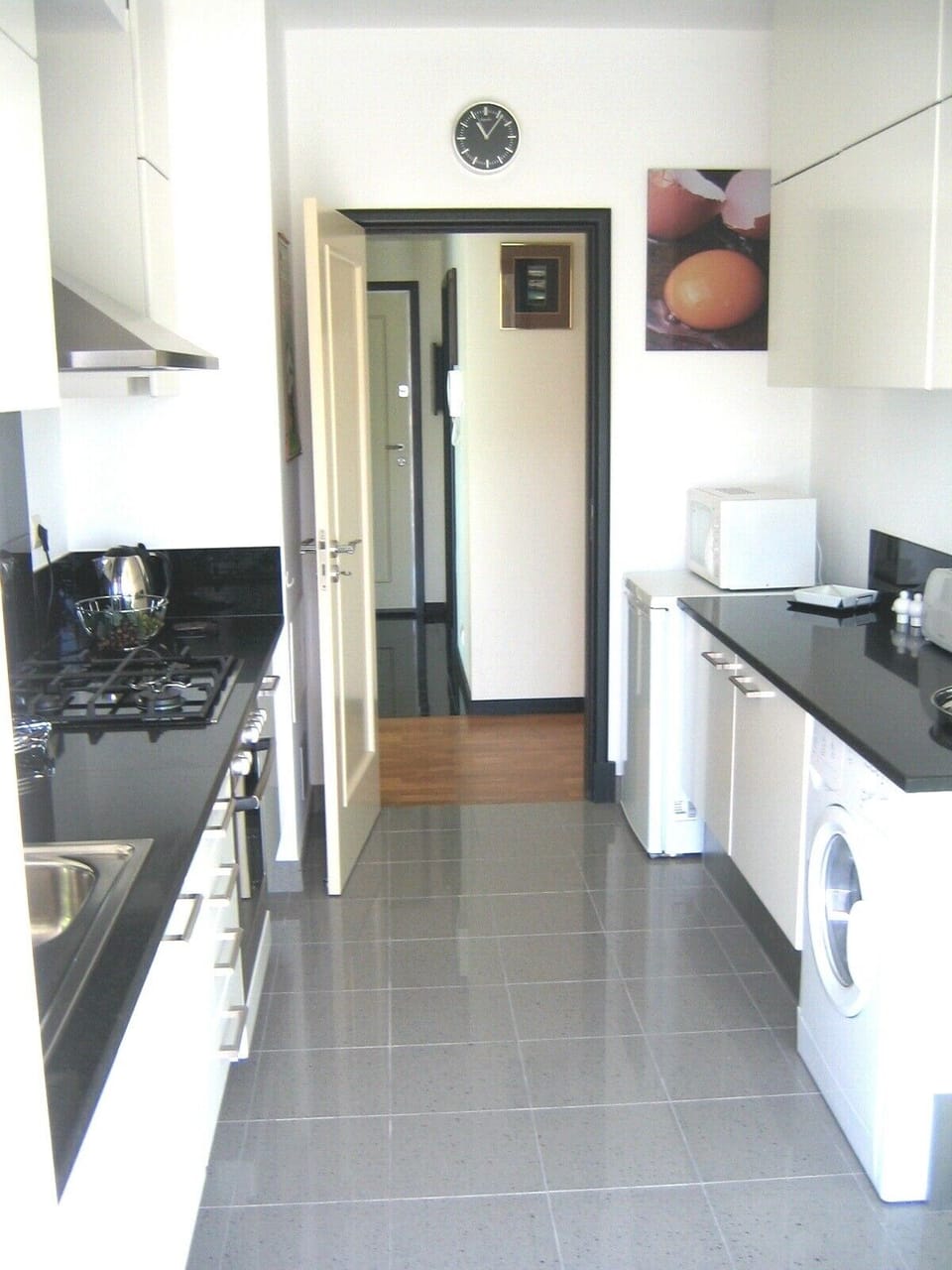 Large kitchen with f.doors leading to the balcony