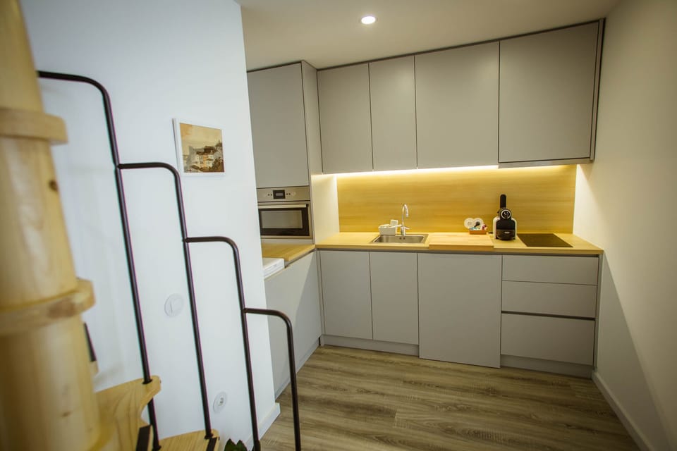 kitchen and spiral staircase to 1st floor