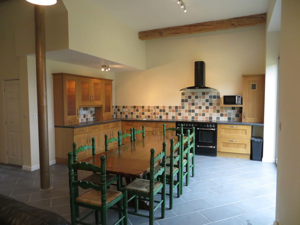 Fully equipped modern kitchen with ample dining space