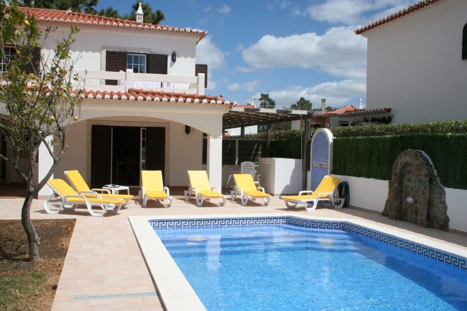 A rear view of the villa and pool