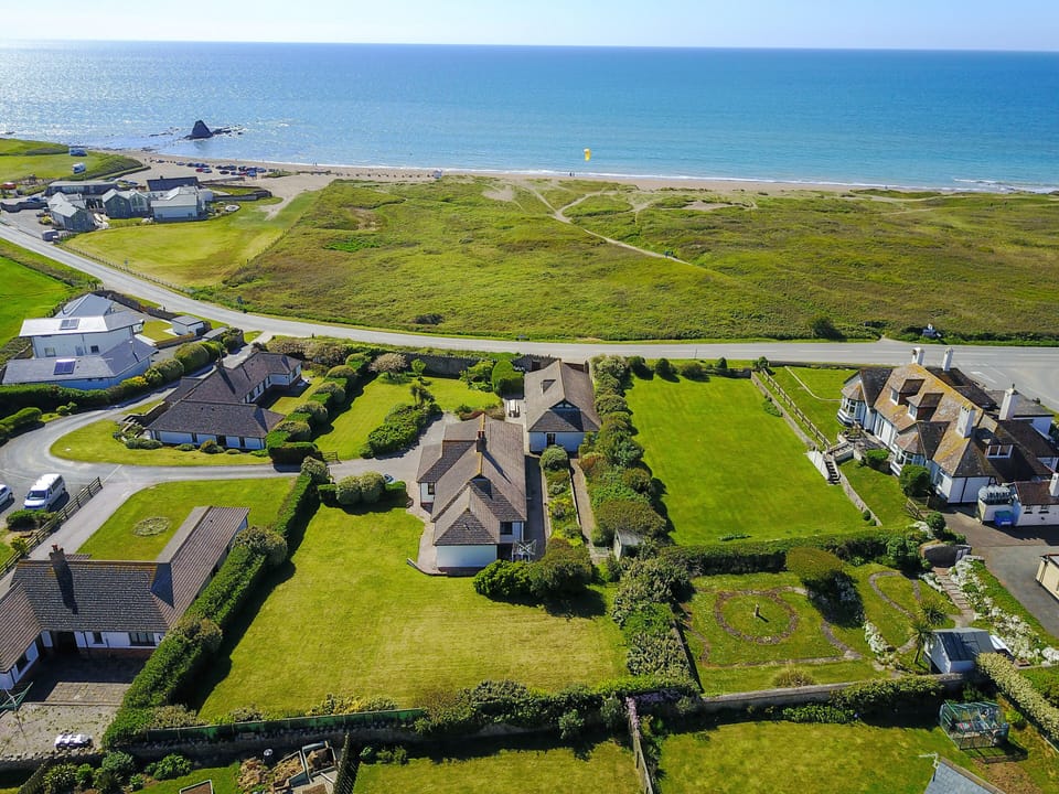 Aerial view of house and beach
