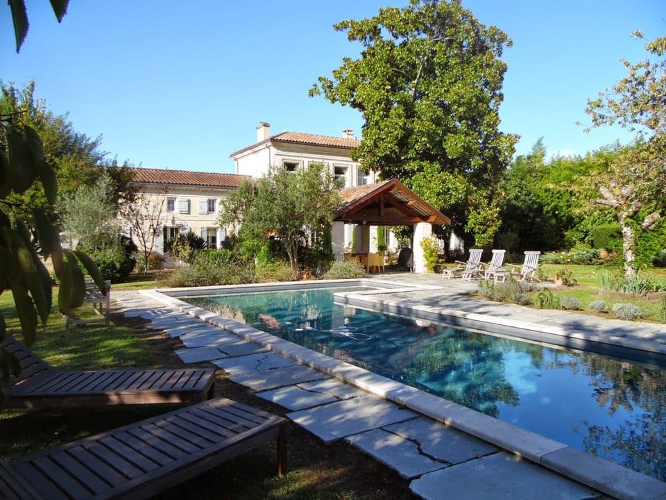 The house faces south over the gardens and the pool