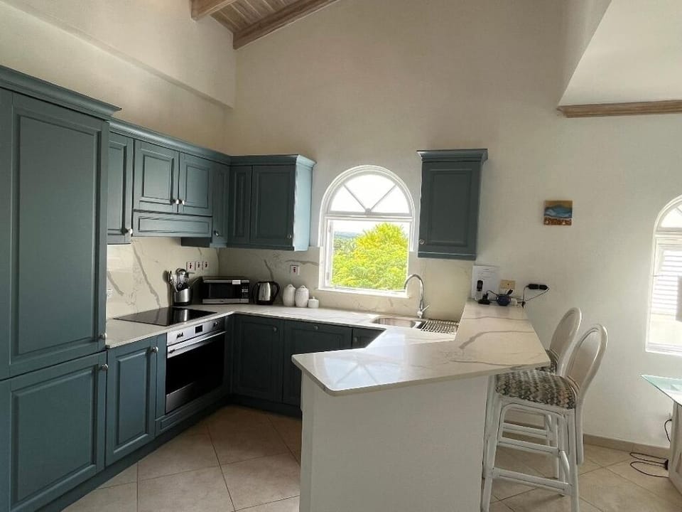 Fully equipped kitchen with breakfast bar and a beautiful view.