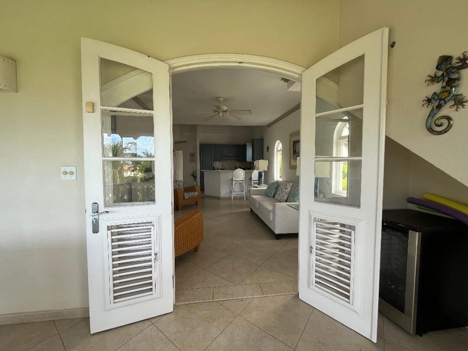 Patio doors leading into open plan lounge and kitchen.