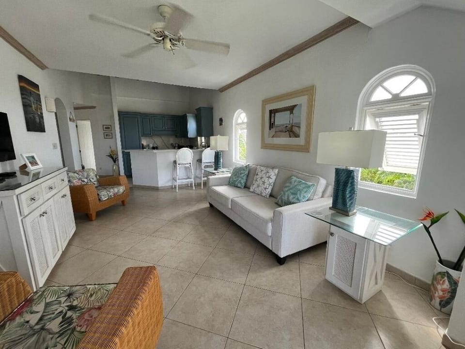 Open plan kitchen and lounge area with Smart Plasma TV.