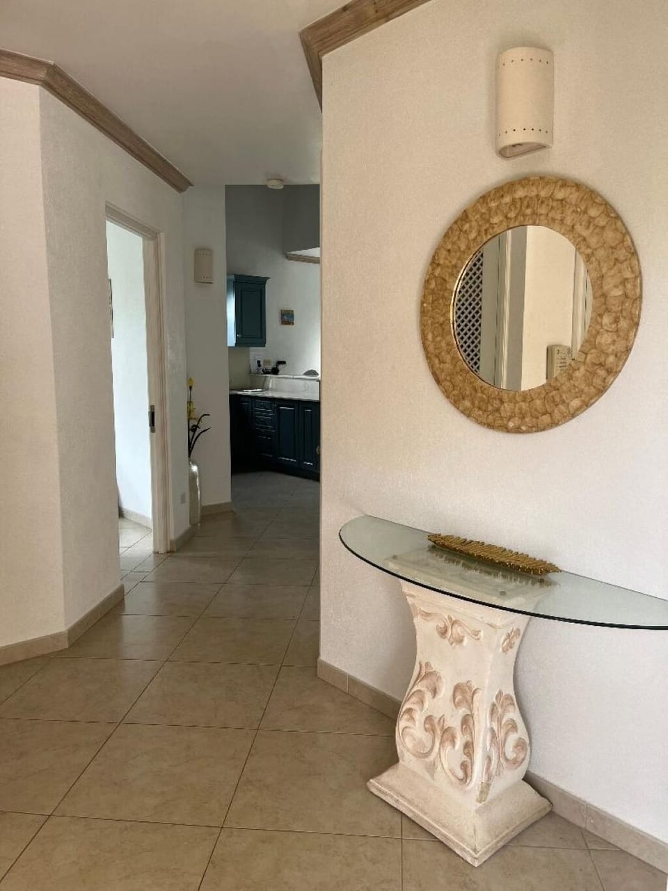 Entrance hallway. Laundry cupboard with washing machine, tumble dryer on left.