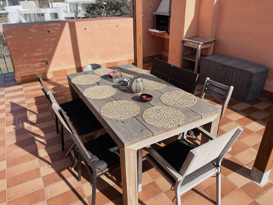 Teak dining table for 8 and BBQ for cozy lunch and dinner parties.