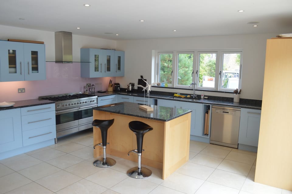 Kitchen with double oven range cooker and island unit