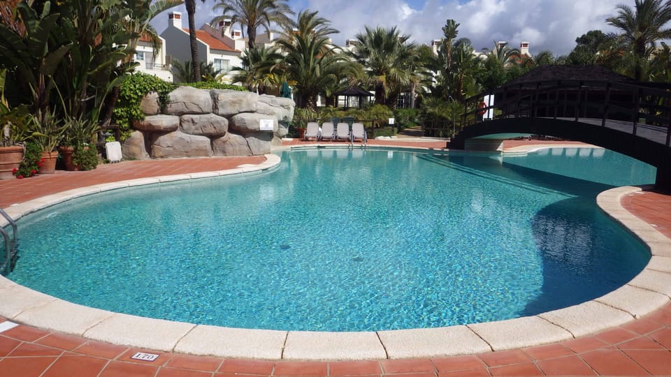 pool which is opposite to the apartment via the patio