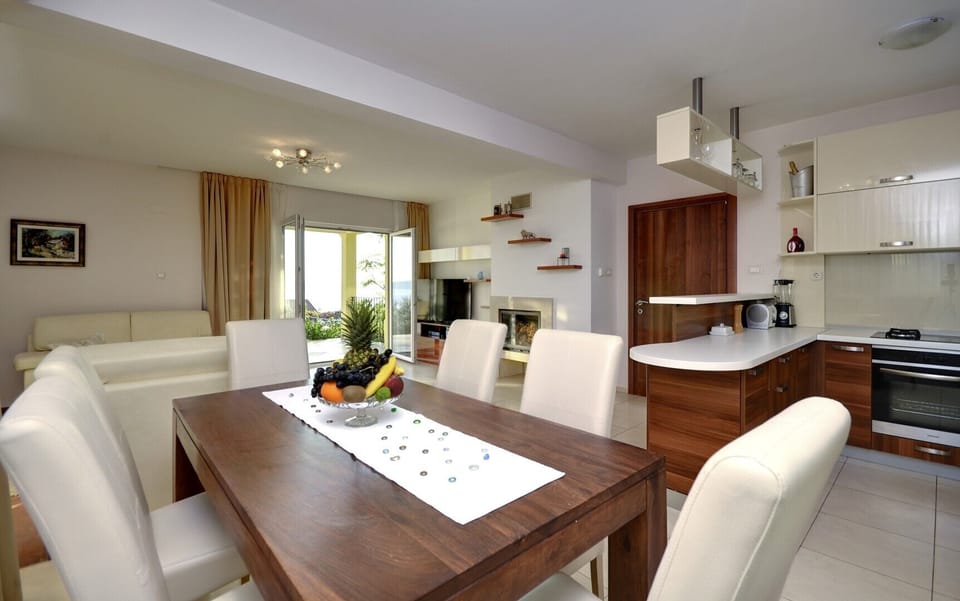 Large dining table next to the kitchen