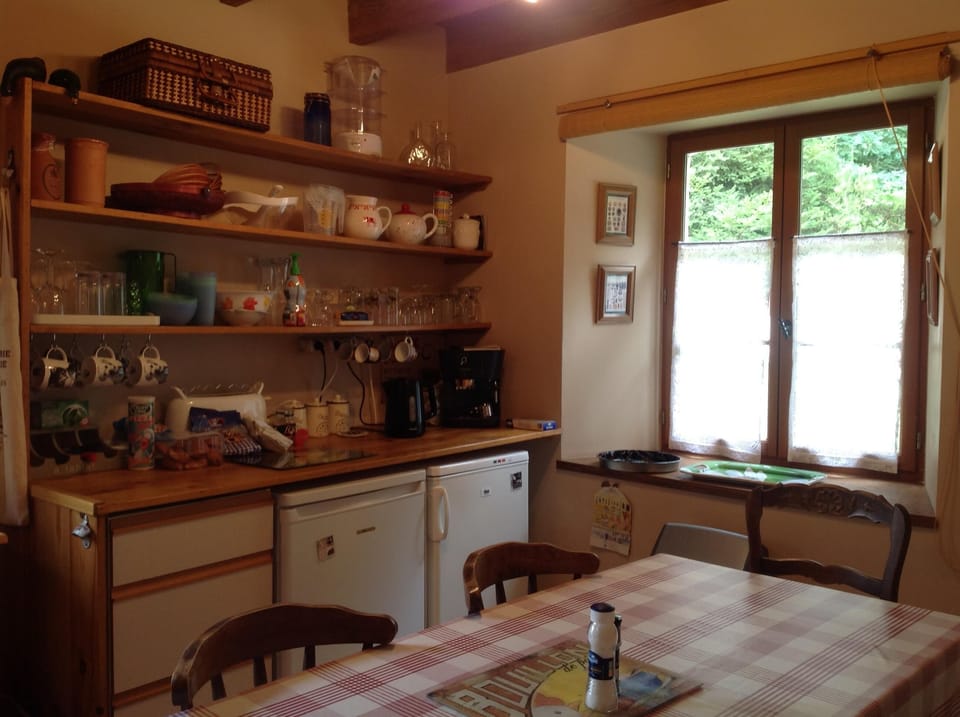 Kitchen showing fridge ,freezer kettle and coffee machine
