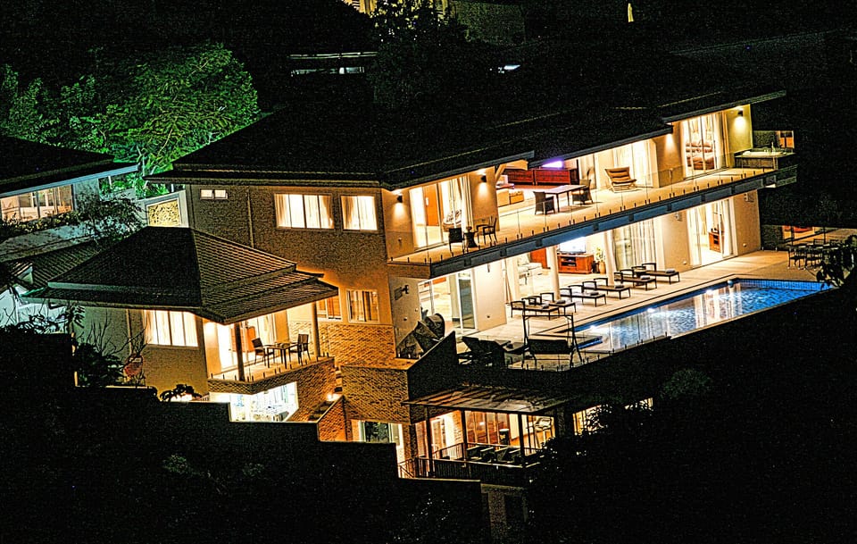 Night view of the Villa from adjacent hillside