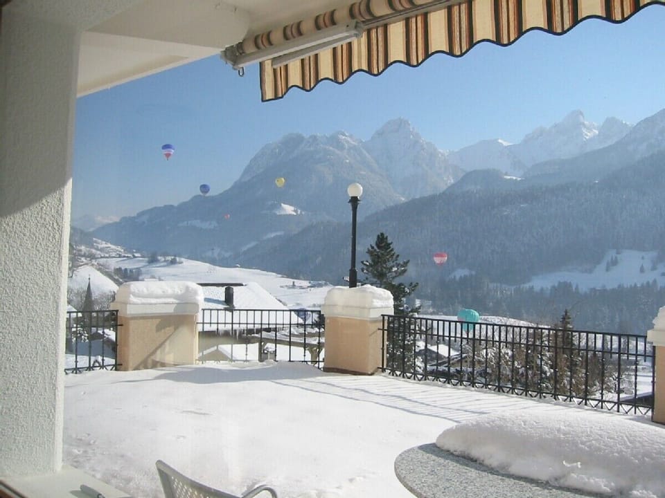Terrace in the snow during Hot Air Balloon Week in Chateau d'Oex
