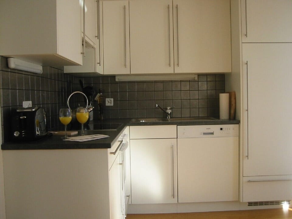 Kitchen integral to the main living area with Nespresso machine