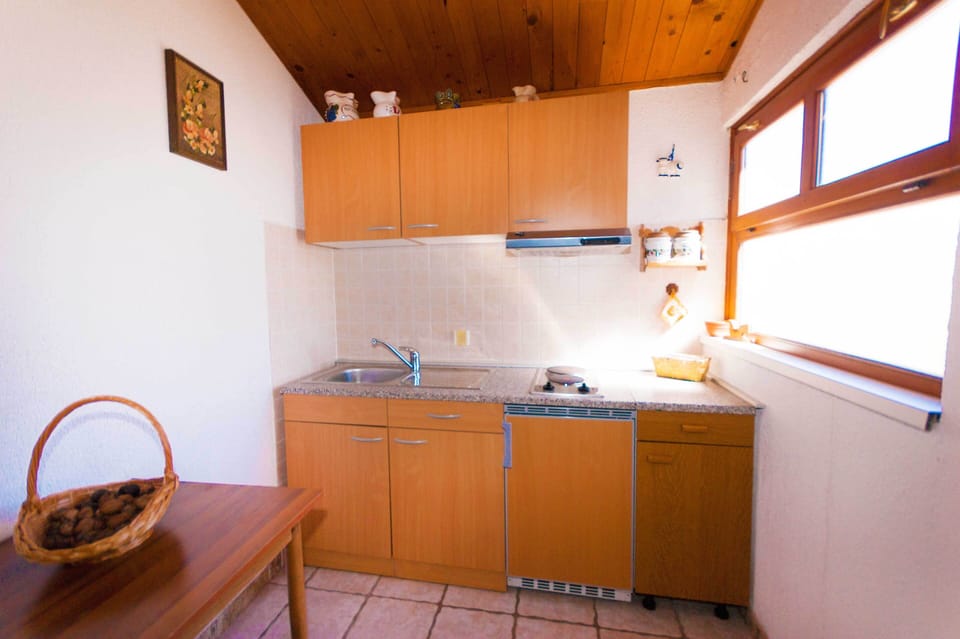 An additional practical kitchen near the pool