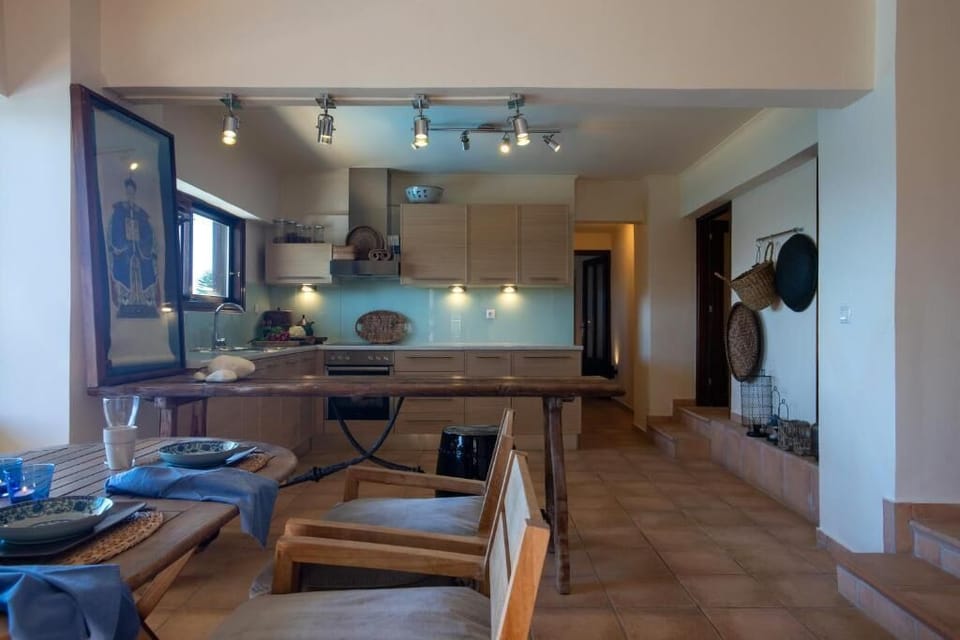 Open-plan living area with a fully equipped kitchen and dining area 