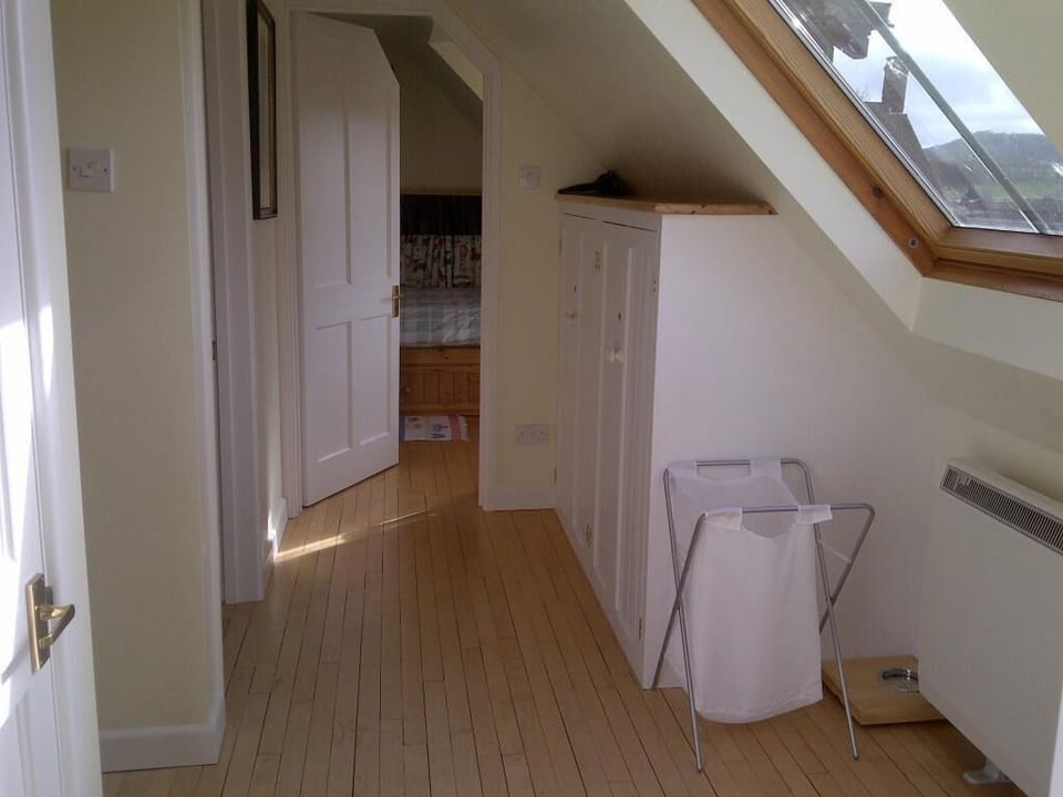 Landing from double bedroom looking past the stairs and bathroom to the twin.