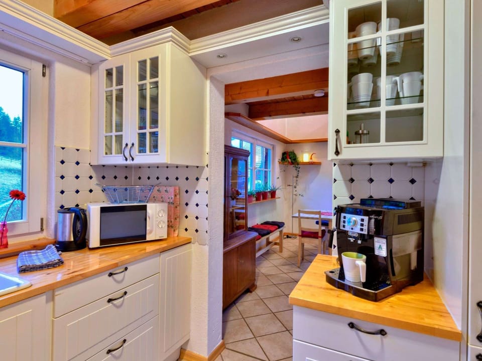 Kitchen with oven and microwave