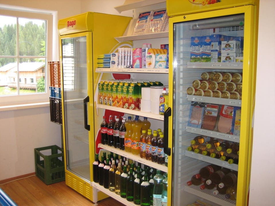 Mini-shop with basic food in reception building, our house visible in the window