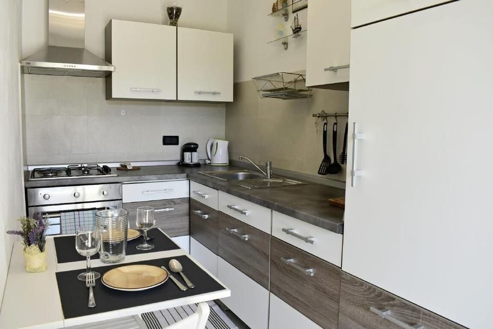 The modern kitchen with dining table and two chairs, ideal for two people