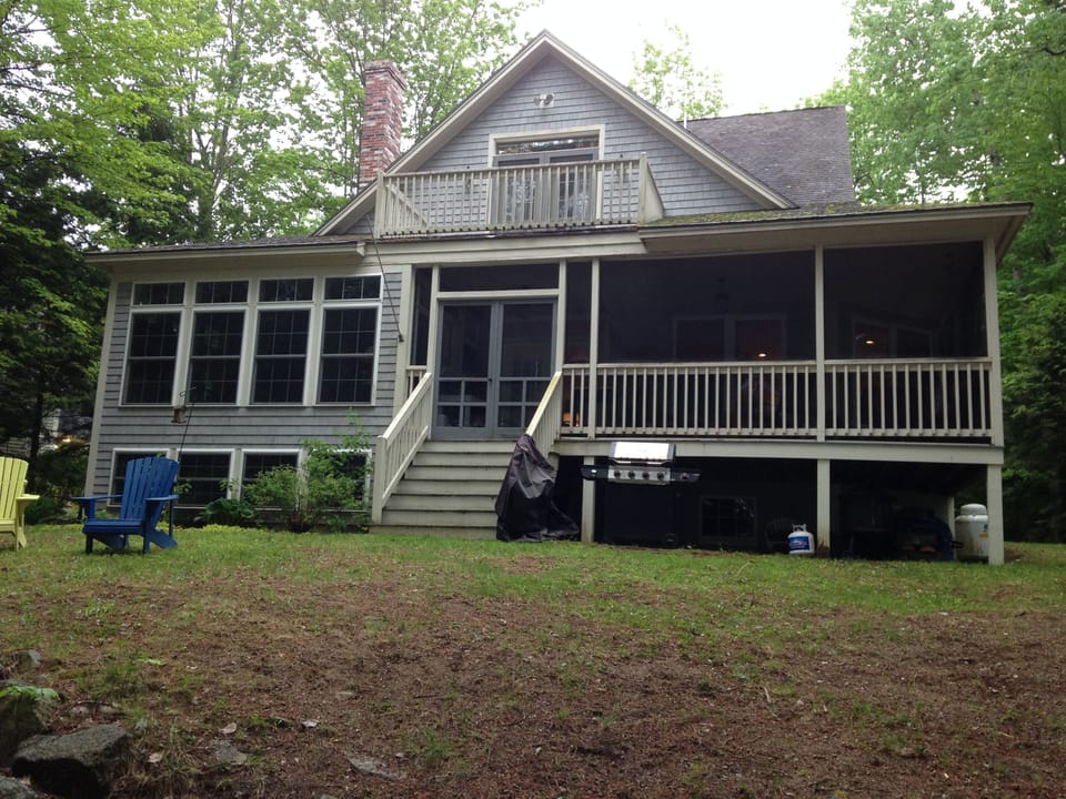 Lake side of the house.  Sun room on left and screened porch on the right.