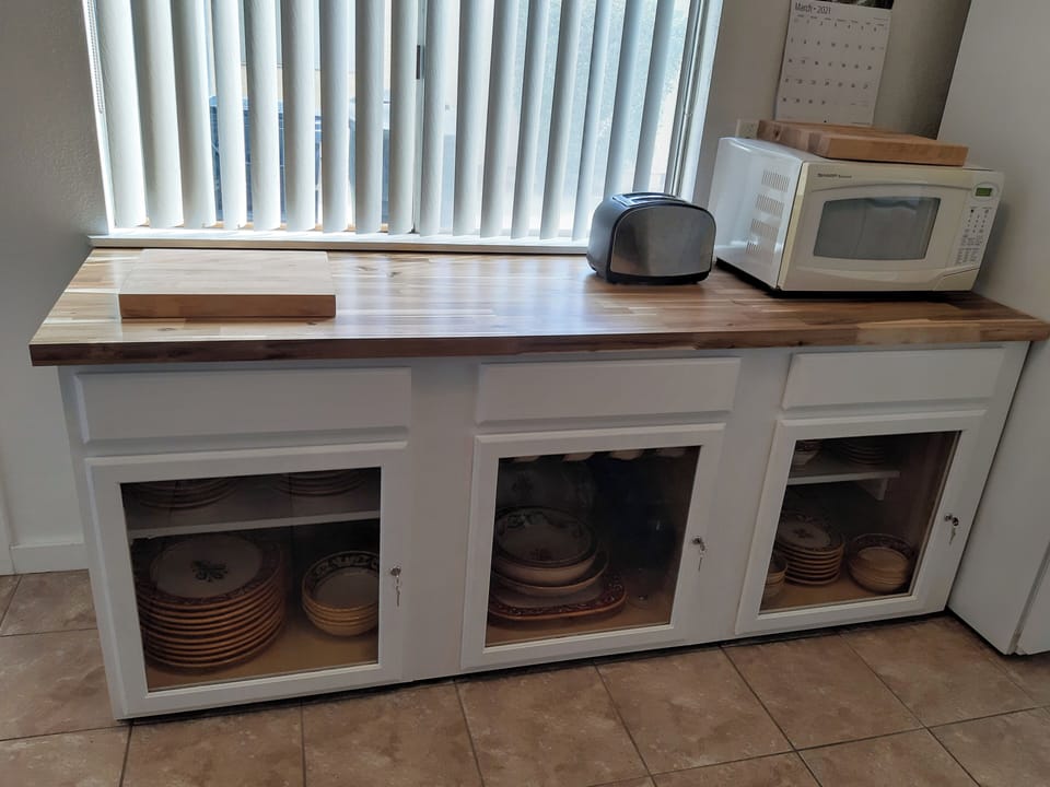 Extended countertop space is provided plus a microwave and toaster. 