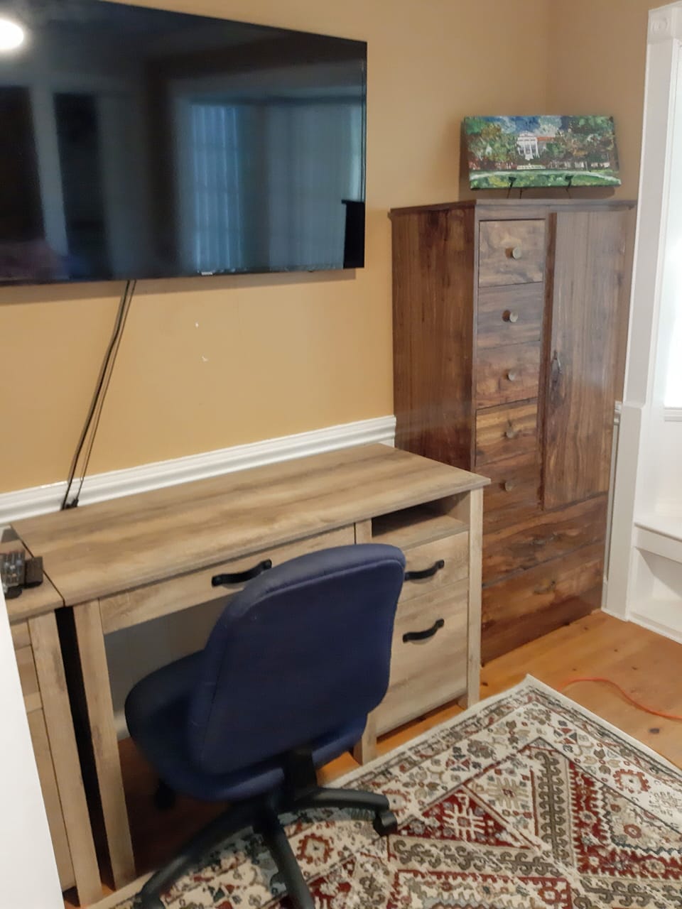 Desk/study area of bedroom 2 also features a sizeable flat screen TV.