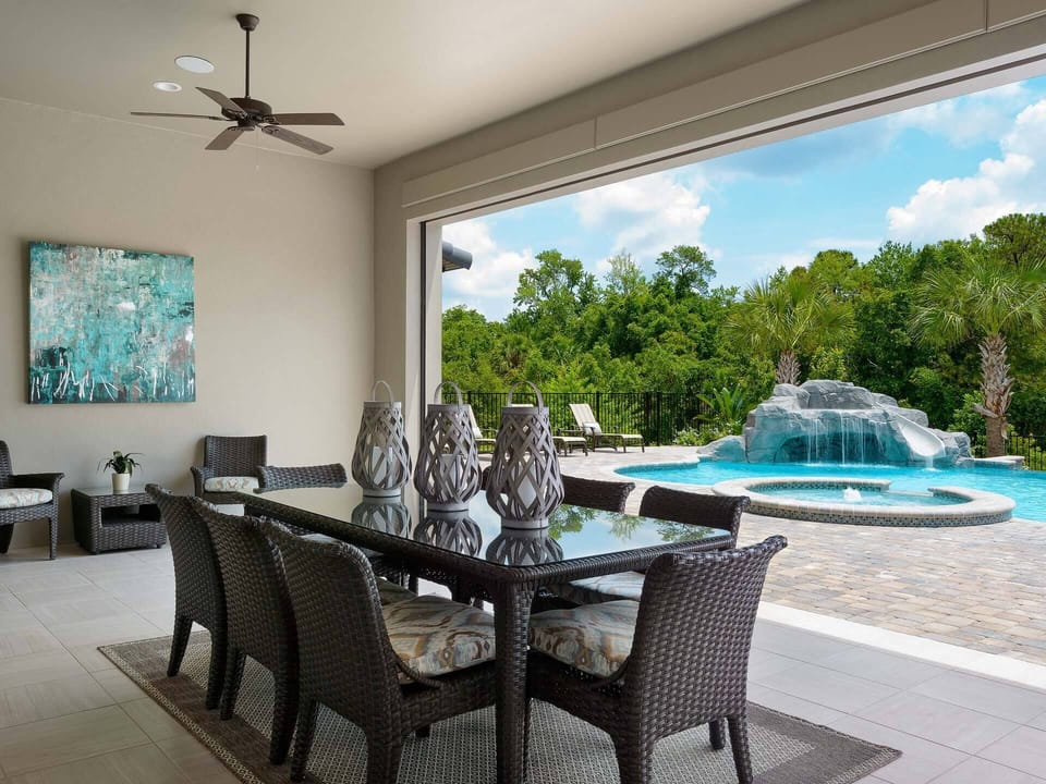 Take in lush views of the pool as you dine under the shade of the covered lanai