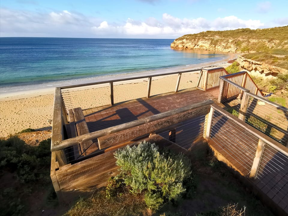 Steps down to the beach located a block away from the house.