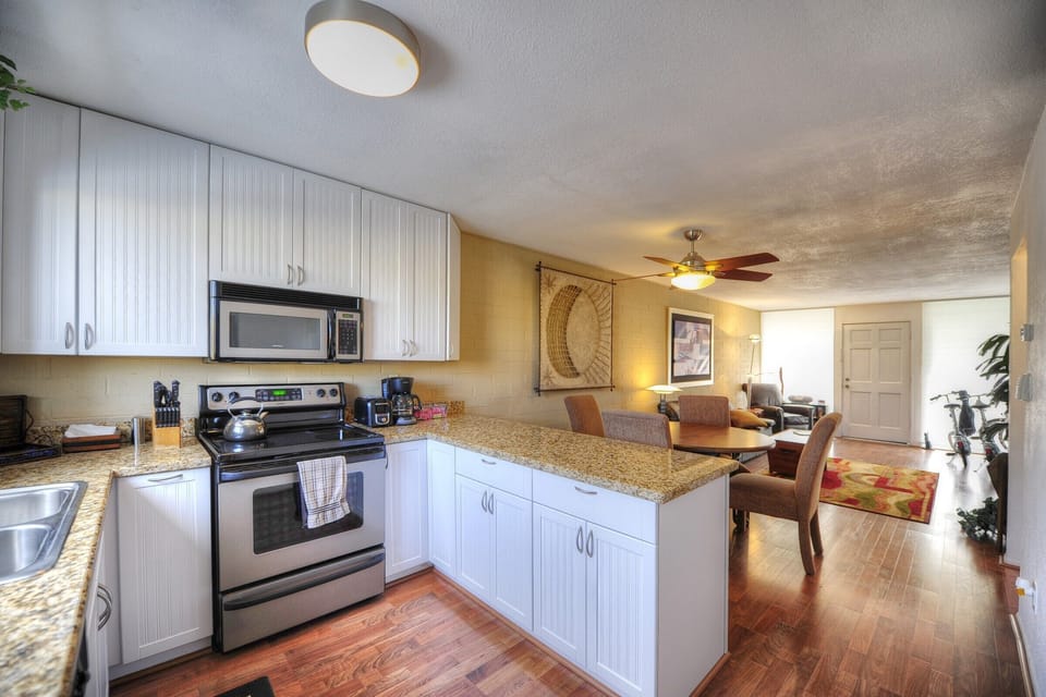 Kitchen w/Stainless Oven, Microwave, Dishwasher, Refrigerator & Pantry.