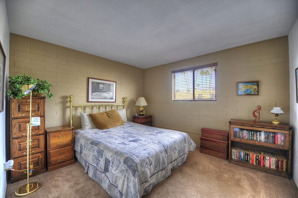 The 2nd bdrm has paperback books, linens, golf clubs & lounge chair cushions.